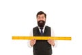 Learning metric system. School teacher. Size really matters. Man bearded hipster holding ruler. Measure length. Measure Royalty Free Stock Photo