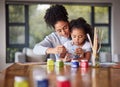 Learning, mother and child painting for an art preschool project with a young mom helping her daughter at home Royalty Free Stock Photo