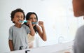Learning, mother and son brushing teeth, dental hygiene and wellness at home, bathroom and bonding. Family, female Royalty Free Stock Photo