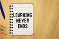 Learning Never Ends, text words typography written on paper, educational life