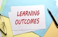 LEARNING OUTCOMES text on paper on colorful paper background Royalty Free Stock Photo