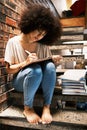 Learning, studying and black woman writing notes in a book, notebook or textbook on house steps. African girl, education Royalty Free Stock Photo