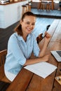 Learning, Studying. Woman Using Laptop Computer At Cafe, Working Royalty Free Stock Photo