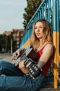 Learning to play the guitar. Beginner Guitar Lesson. Close-up of female hand playing Acoustic guitar. Music education and extra- Royalty Free Stock Photo