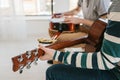 Learning to play the guitar. Music education and extracurricular lessons. Hobbies and enthusiasm for playing guitar and Royalty Free Stock Photo