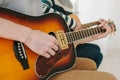 Learning to play the guitar. Music education and extracurricular lessons. Hobbies and enthusiasm for playing guitar and