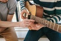 Learning to play the guitar. Music education and extracurricular lessons. Hobbies and enthusiasm for playing guitar and Royalty Free Stock Photo