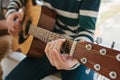 Learning to play the guitar. Music education and extracurricular lessons. Hobbies and enthusiasm for playing guitar and Royalty Free Stock Photo