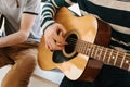 Learning to play the guitar. Music education and extracurricular lessons. Hobbies and enthusiasm for playing guitar and Royalty Free Stock Photo