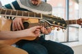 Learning to play the guitar. Music education and extracurricular lessons. Hobbies and enthusiasm for playing guitar and Royalty Free Stock Photo