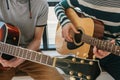 Learning to play the guitar. Music education and extracurricular lessons. Hobbies and enthusiasm for playing guitar and Royalty Free Stock Photo