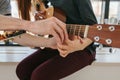 Learning to play the guitar. Music education and extracurricular lessons