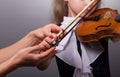 Learning to play the violin. Little girl and the teacher plays the violin Royalty Free Stock Photo