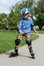 Learning to ride on rollerblades Royalty Free Stock Photo