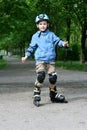 Learning to ride on rollerblades Royalty Free Stock Photo