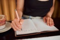 Learning woman writing in notebook, university student studying in library and education on paper in classroom. Creative Royalty Free Stock Photo