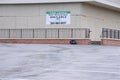 For Lease sign on boarded up business building