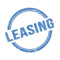 LEASING text written on blue grungy round stamp