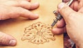 Leather artisan craftsman drawing an ornament
