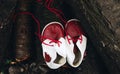 Leather baby vintage red boots on wood Royalty Free Stock Photo