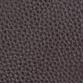 Leather background, brown, bumpy, textured. Bonded reconstituted leather. Substitute for genuine natural material. Dark backdrop