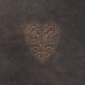 Leather Background with embossed folklore style birds heart Royalty Free Stock Photo