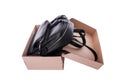 Leather backpack in a cardboard box. Royalty Free Stock Photo