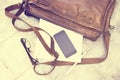 Leather bag with blank diary, cell phone Royalty Free Stock Photo