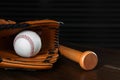 Leather baseball ball, bat and glove on table Royalty Free Stock Photo