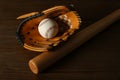 Leather baseball ball, bat and glove on table Royalty Free Stock Photo