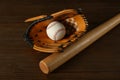 Leather baseball ball, bat and glove on table Royalty Free Stock Photo
