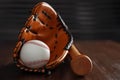 Leather baseball ball, bat and glove on table, closeup Royalty Free Stock Photo