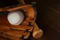 Leather baseball ball, bat and glove on table, closeup Royalty Free Stock Photo