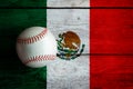 Leather Baseball on Rustic Wooden Background Painted With Mexican Flag Royalty Free Stock Photo