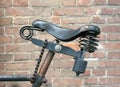 Leather bike saddle locked to the frame with a chain