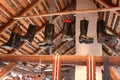 Leather boots hanging from the beam