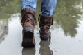 Leather boots on a wet sidewalk in the rain.