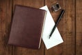 Leather bound journal, blue envelope, ink well and pen Royalty Free Stock Photo