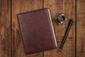 A leather bound journal, and ink well and pen Royalty Free Stock Photo