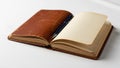 Leather bound notebook lies on a white surface revealing blank cream Royalty Free Stock Photo