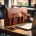 Leather Briefcase with Work Essentials on Office Table