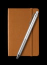Leather closed notebook and pen isolated on black Royalty Free Stock Photo