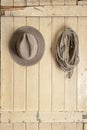 Leather cowboy hat hanging on an old door Royalty Free Stock Photo
