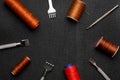 Leather crafting DIY tools and threads lies on natural black leather. Royalty Free Stock Photo