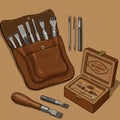 A leather crafting tool set is displayed on a tan surface. It includes a brown leather Royalty Free Stock Photo