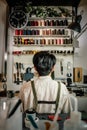 Leather craftsman working in front of tools shelf