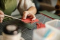 Leather craftsman working with leather glue