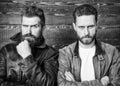 Leather fashion menswear. Handsome stylish and cool. Brutal men wear leather jackets. Men brutal bearded hipster posing