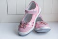 Leather girl shoes.Pink leather kids sandals isoalted on white background.Baby Kid`s modern sneakers shoe