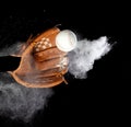 Leather glove mitt receive hit baseball ball and dust soil explode in air. Baseball ball throw and hit to center of mitt glove. Royalty Free Stock Photo